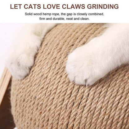 Cat's paws scratching the tightly wound natural rope ball